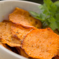 sweet potato chips in bowl with cilantro