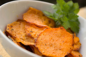 sweet potato chips in bowl with cilantro