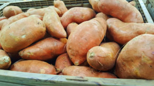 orange sweet potatoes in basket