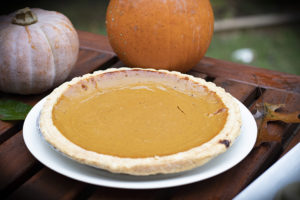 pumpkin pie on tabel with pumpkin
