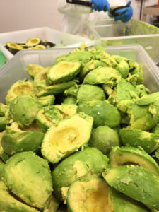 a tub of peeled avocados