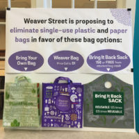 poster in store with three bag options attached