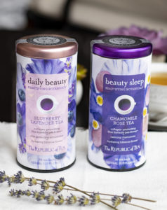 two canisters of tea with some sprigs of lavender