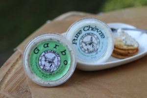 two cnotainers of cheese spread with labels from Celebrity Dairy