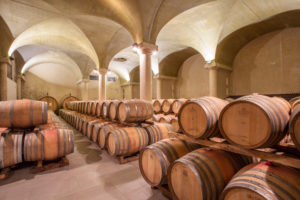 casks of wine in a vaulted room