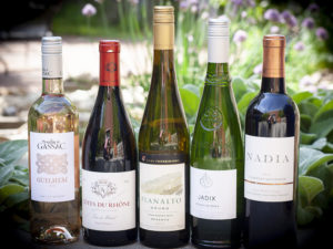 five wine bottles in a row