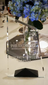 award that is a clear piece of glass with "Philanthropy" and our name etched in it