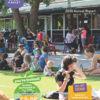 cover of annual report showing people sitting on the lawn and patio