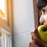 child eating apple