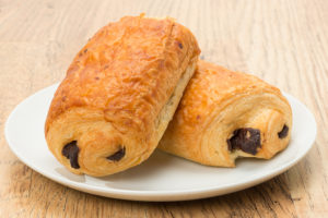 Pain au chocolat pastries on plate, also called chocolate croissants