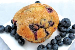 muffin with blueberries on plate