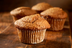 bran muffins on wooden cutting board