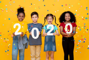 Cute smiling ethnically diverse kids showing numbers 2020