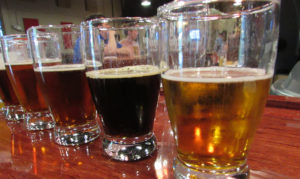 row of beers in glasses