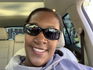 Allanah wearing sunglasses in car